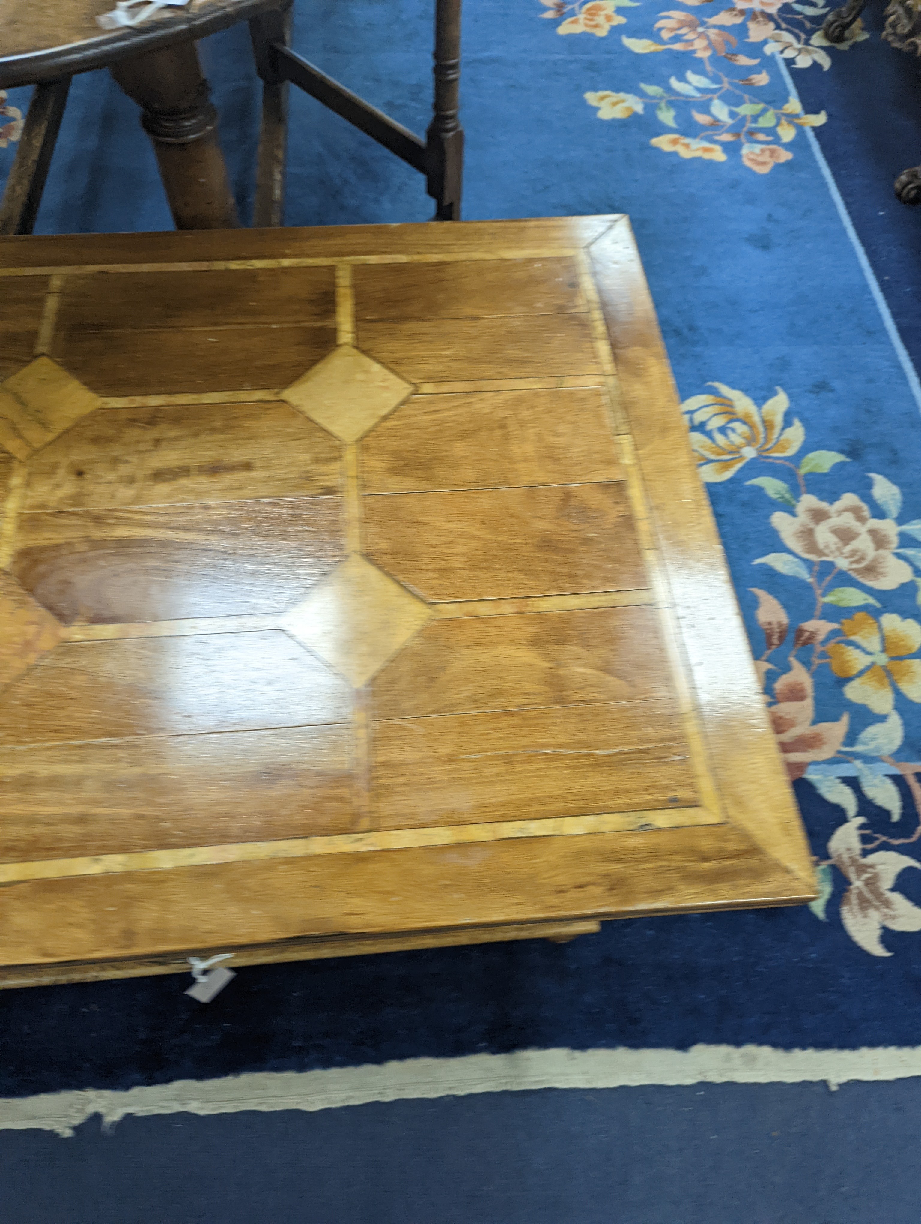 A hardwood and marble inset coffee table, length 130cm, depth 80cm, height 45cm